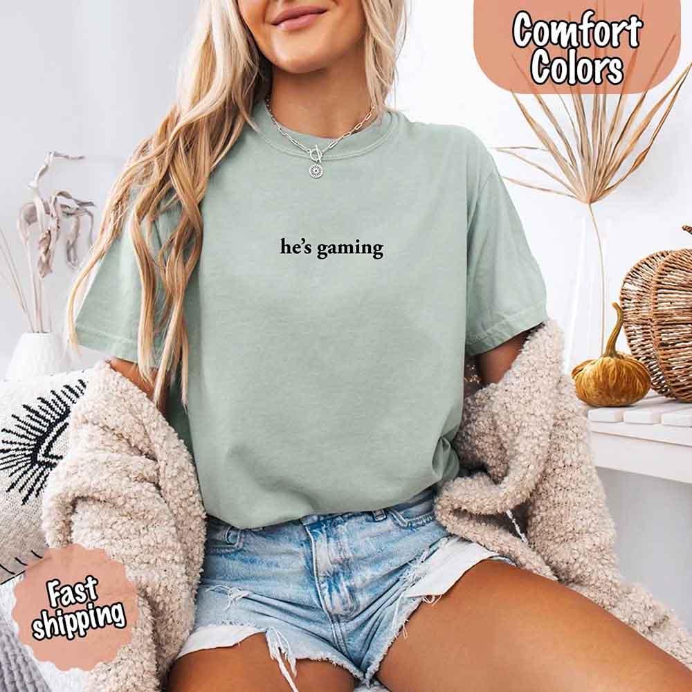 He’s Gaming – Funny Relationship Comfort Color Shirt for Her