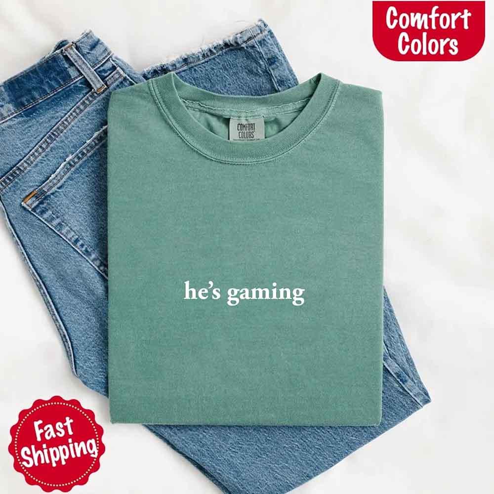 He’s Gaming – Funny Relationship Comfort Color Shirt for Her